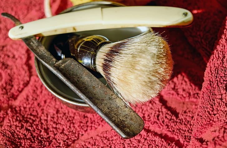 beige handle straight razor