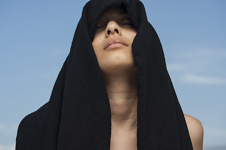 woman wearing black headdress