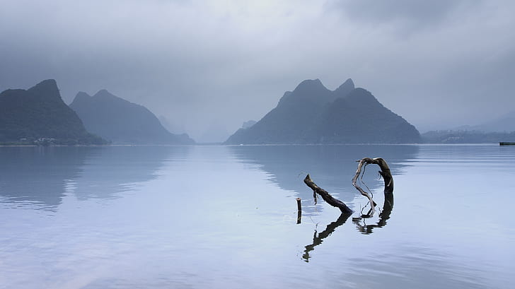 photo of a body of water and mountain
