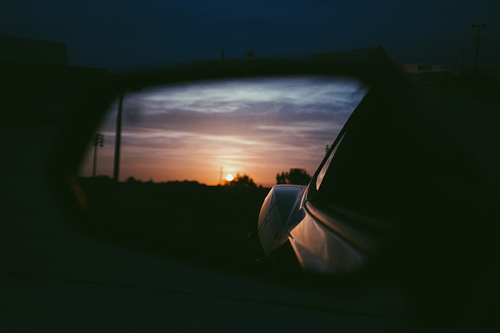 sunset reflect on car side mirror