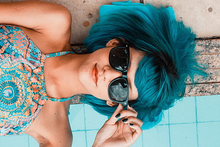 blue haired woman wearing black framed sunglasses
