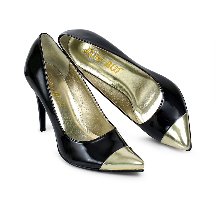 pair of black-and-gold leather pointed-toe stiletto shoes