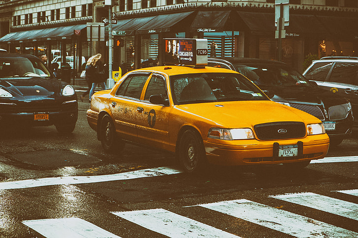 Street shot of a classic yellow taxi in Manhattan, New York City, image captured with a Canon 5D