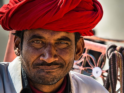 man wearing red turban and white shirt