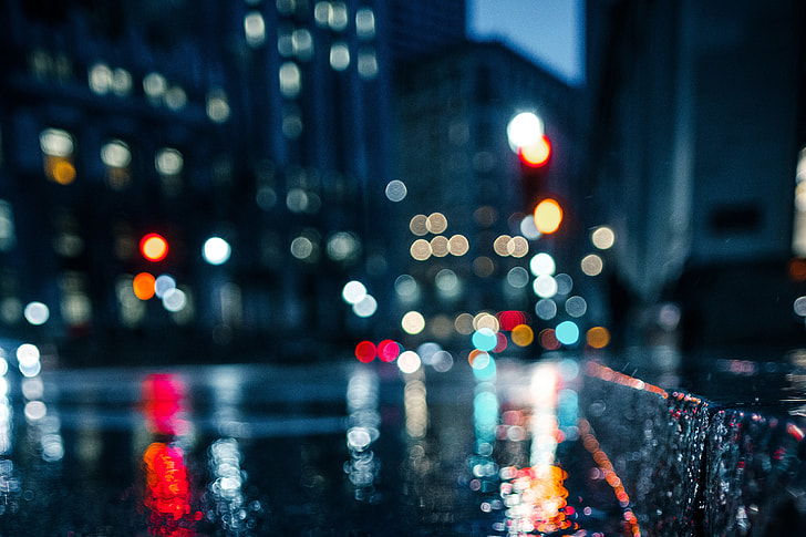 A wet city street at night