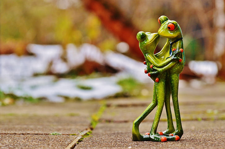 two green frog ceramic figures