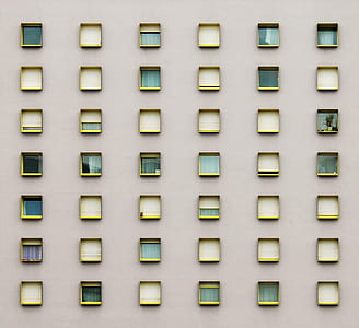assorted windows on gray wall