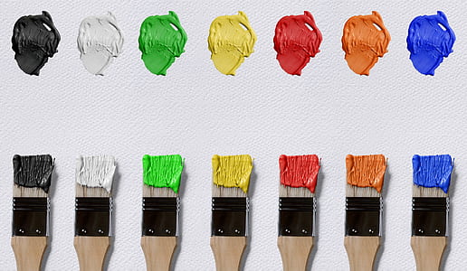 seven brushes with different color of paints