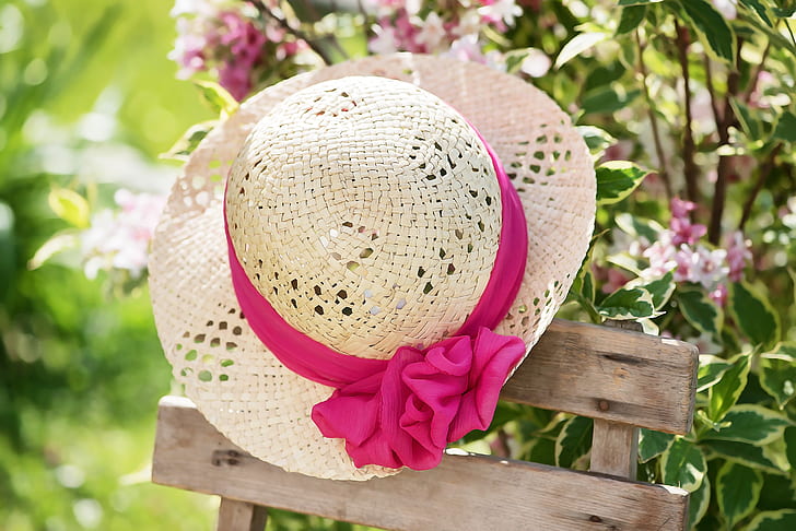 brown straw hat with pink bow accent