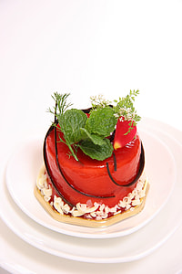 red icing cake on white ceramic plate