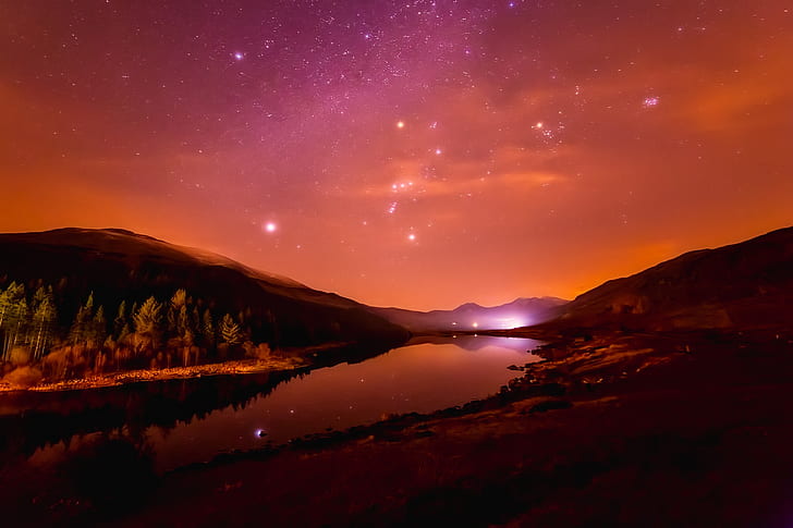 photo of mountain near river with stars
