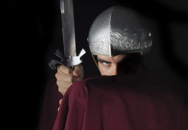 man in red cape and silver helmet holding silver sword
