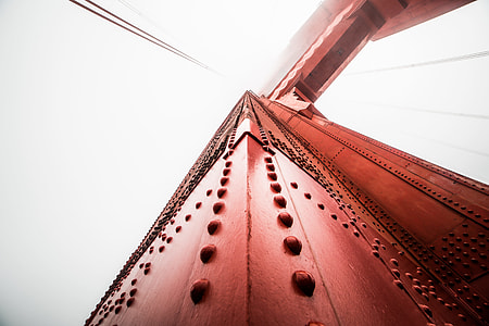Pillar of The Golden Gate Bridge Against Foggy Sky