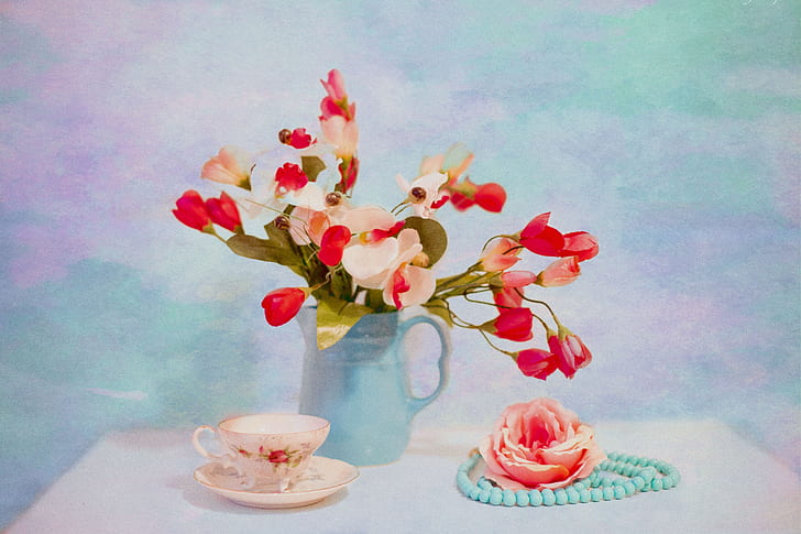 red and white flowers in green vase near white teacup still life painting