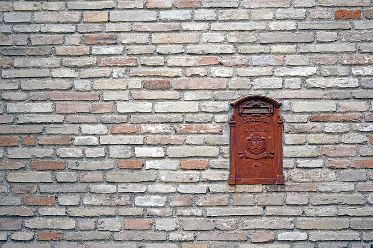 rectangular brown wooden mailbox door art