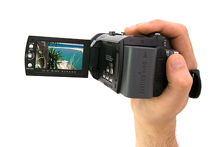 person holding handycam