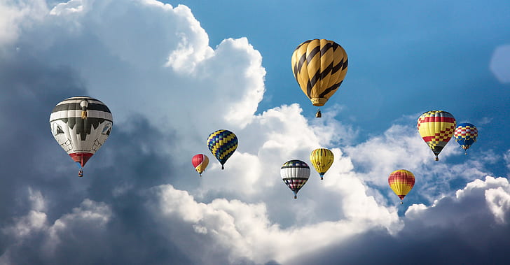 hot air balloons fly on sky