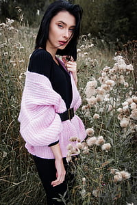 woman wearing black and pink dress on flower field