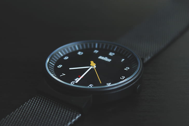 round black analog watch with black strap
