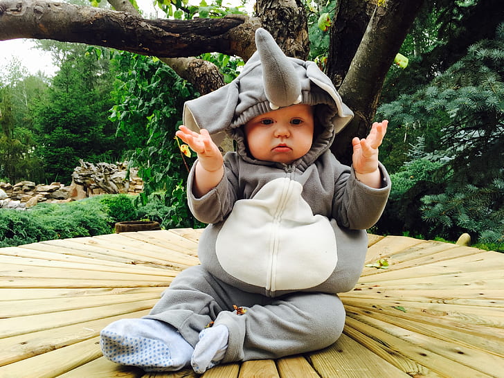 baby wearing gray elephant footie hoodie pajama