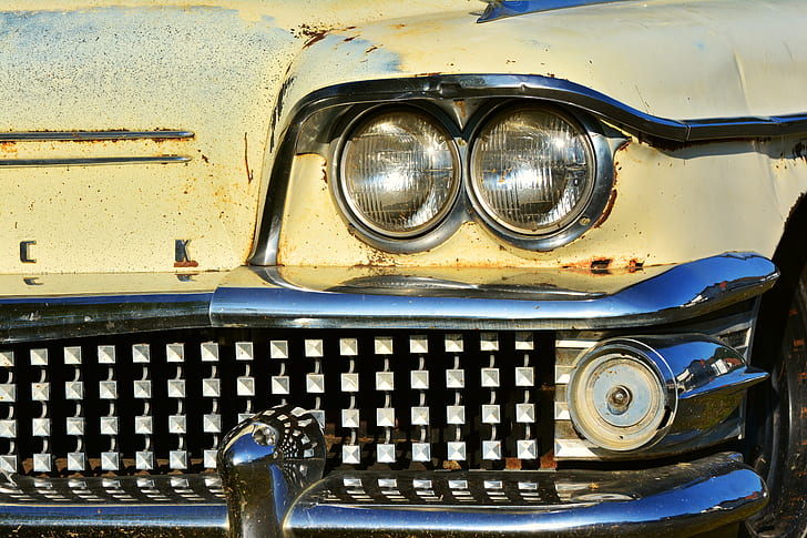 closeup photography of classic yellow car