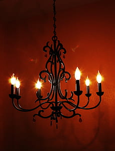 brass-colored uplight chandelier