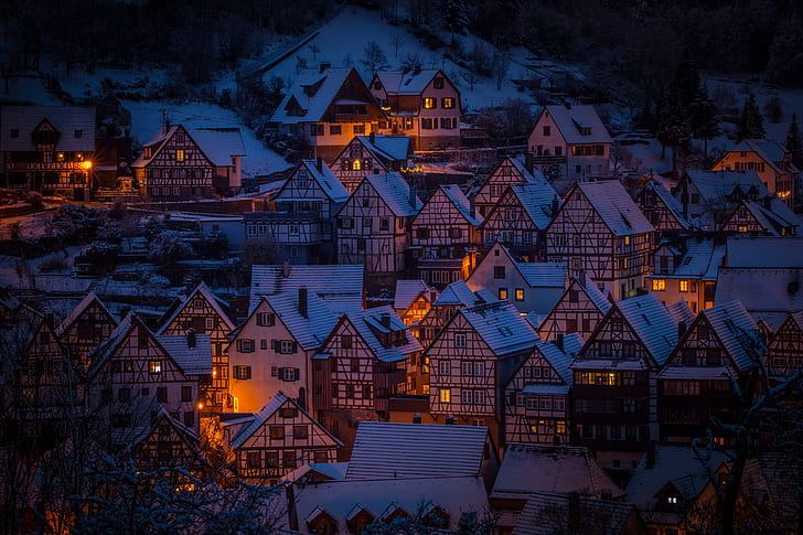 assorted houses with orange lights during daytime