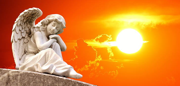 white ceramic lady angel figurine with sunset background