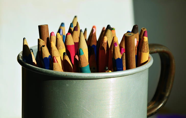 assorted color pencil on grey mug