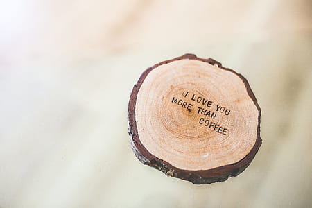 photo of brown board with i love you more than coffee text overlay
