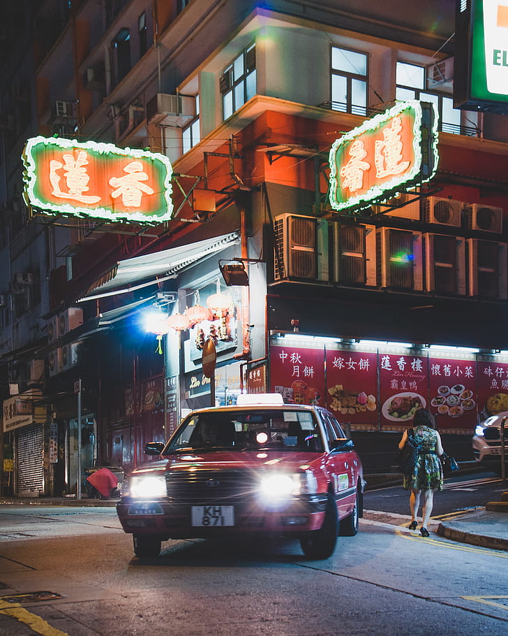 red car passing through a building