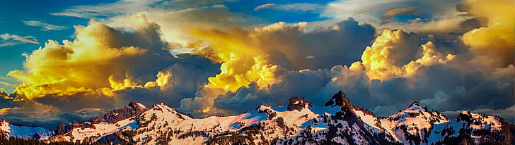 snowy mountain range and yellow clouds at daytime