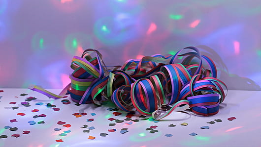 multicolored ribbon on top of white surface with lights