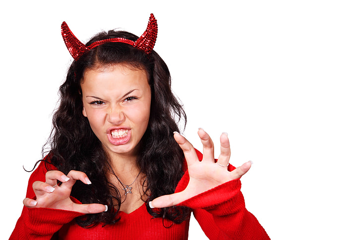 The girl is the image of the devil, contact lenses and with horns