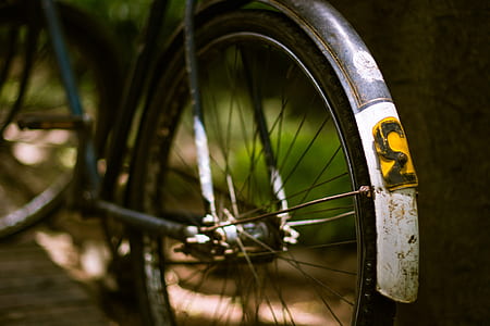 selective focus photography of bicycle wheel
