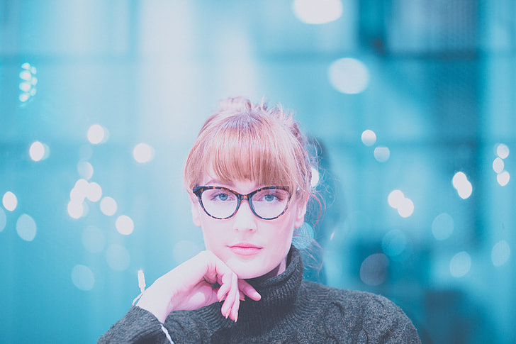 woman in gray turtleneck fabric tops with brown and black eyeglasses