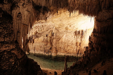photography of stalactites and stalagmites