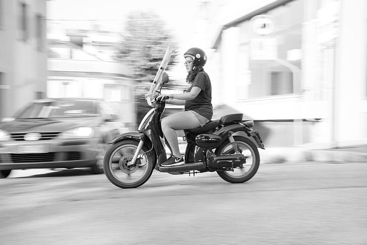 Woman Riding on Scooter Motorcycle