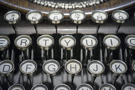 close-up photography of white typewriter keys