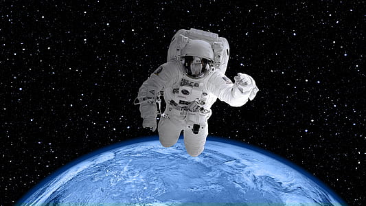 astronaut in suit outside planet Earth