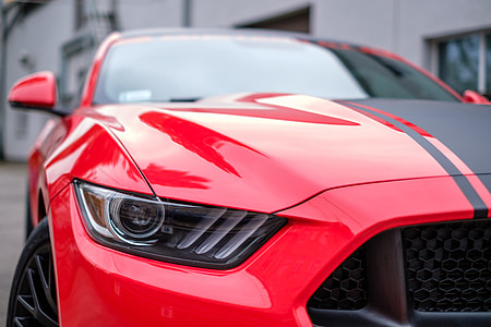 photography of red and black Ford Mustang