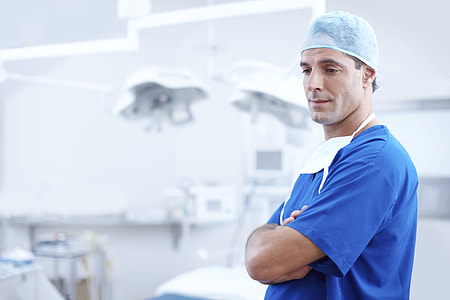 man wearing blue nursing scrub top