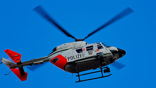 white and red Polizei helicopter