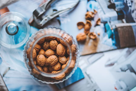 closeup photo of almonds in clear mason jar