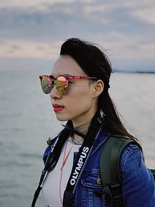 woman wearing sunglasses and jacket
