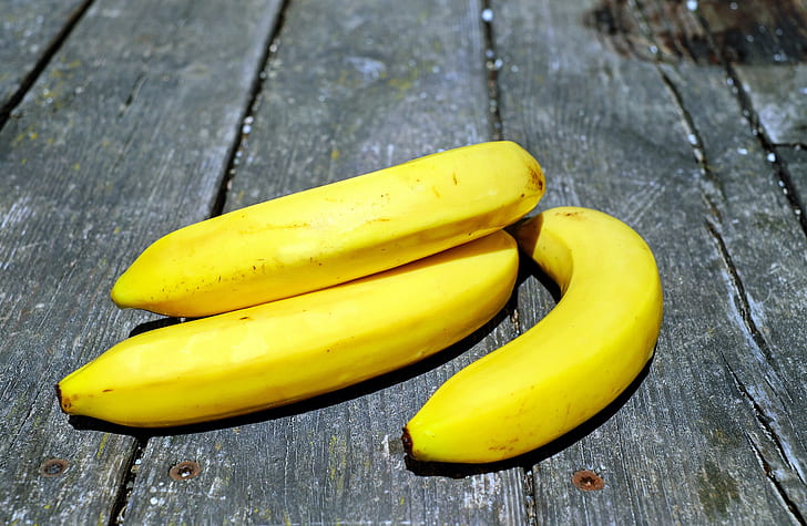 three yellow ripe bananas