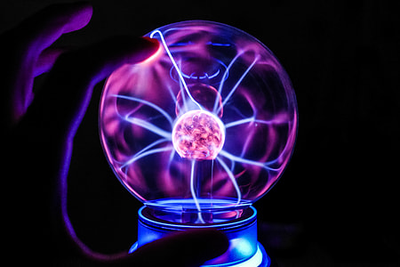 Touching The Plasma Ball Lamp