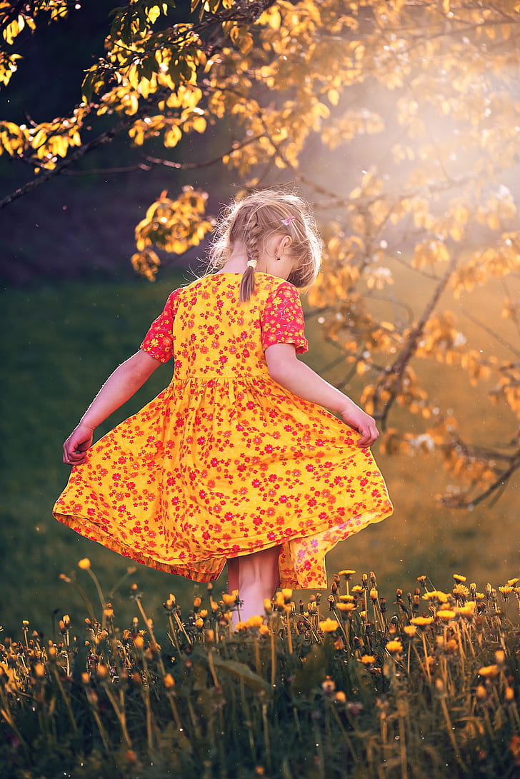 toddler girl in yellow floral dress