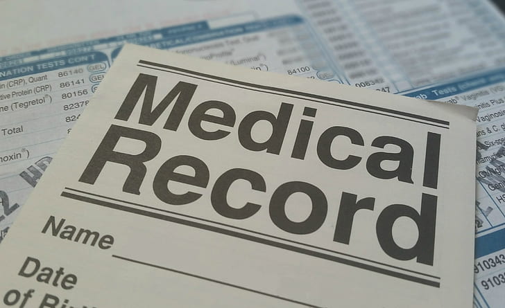 Medical Record form on blue and white paper