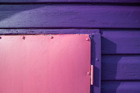 Details of purple and pink wood panels, image captured in Kent, England